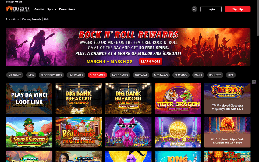 Screenshot of the FireKeepers Casino iGaming homepage showing slot game thumbnails, navigation menu, and a Rock N’ Roll Rewards promotion banner offering free spins and bonus credits.