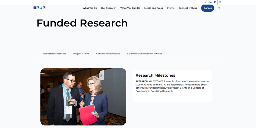 ICRG Funded Research page with researchers speaking at a conference.