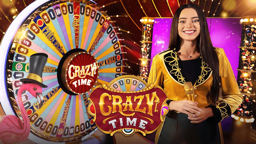Crazy Time Προωθητική εικόνα του Crazy Time με τον χαρακτηριστικό πολύχρωμο τροχό και παρουσιάστρια στο στούντιο.